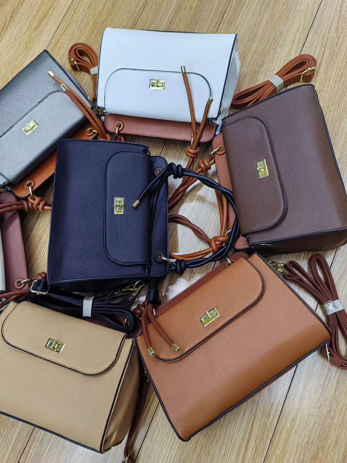 Lace & Luxe pebbled leather handbag with structured top handle and crossbody strap for women, stylish and versatile purse.