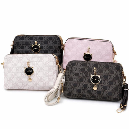 Black Lace & Luxe monogram crossbody bag with cat charm, small patterned shoulder purse for women, stylish and compact accessory.